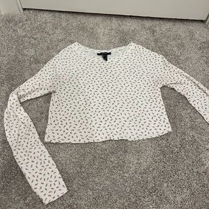 White top with pink and green flowers